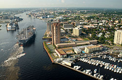 US Navy 030820-N-9851B-011 Tug boats guide USS Harry S. Truman (CVN 75) up the Elizabeth River, past Portsmouth landmarks